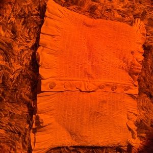 a white tube top with ruffles on the ends